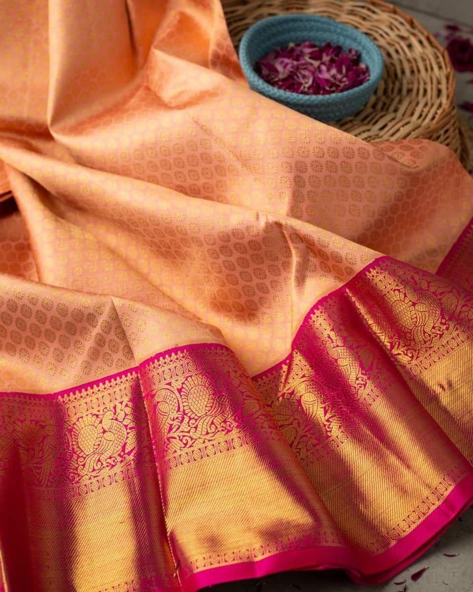 Vrishti - Peach Soft Banarasi Silk Saree with Pink Jacquard Zari Border