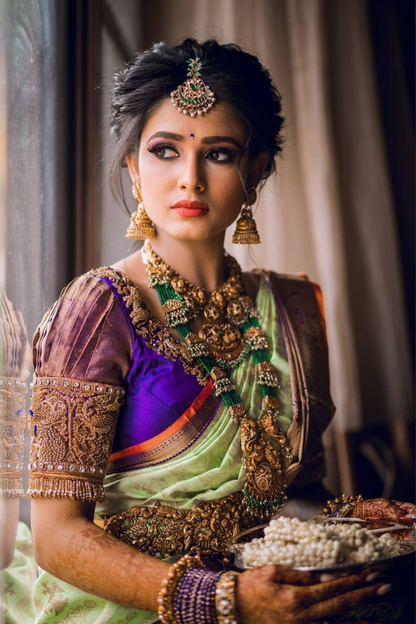 Pastel Green Kanchipuram Silk Saree with Royal Purple Zari Border