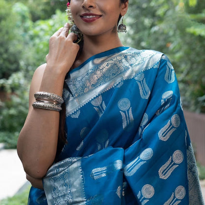 Ornate Blue Soft Silk Saree With Denouement Blouse Piece