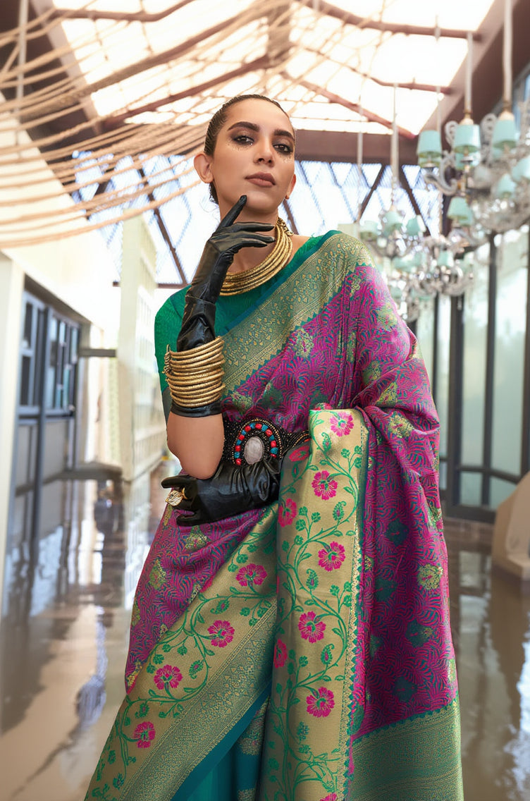 Woman wearing a traditional saree with a floral pattern in a bright indoor setting