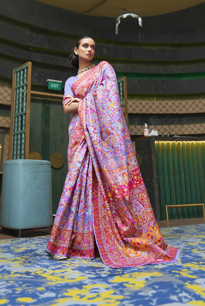 Woman wearing a colorful saree in an indoor setting