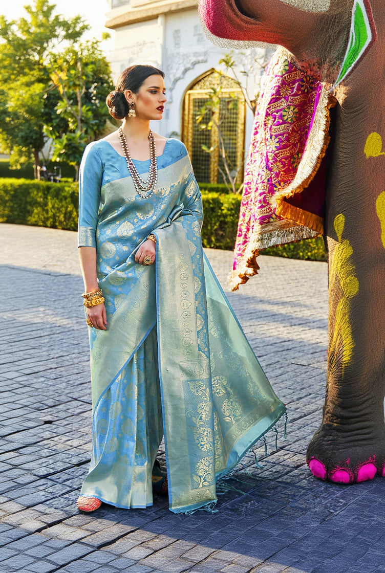 Arresting Firozi Kanjivaram Silk Saree With Flamboyant Blouse Piece
