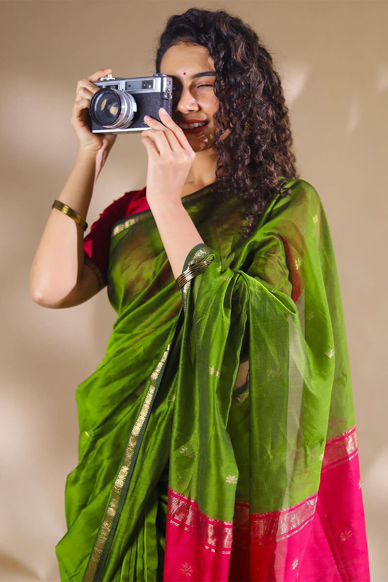 Opulent Green Cotton Silk Saree With Demanding Blouse Piece
