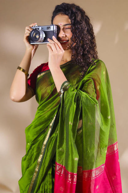 Opulent Green Cotton Silk Saree With Demanding Blouse Piece