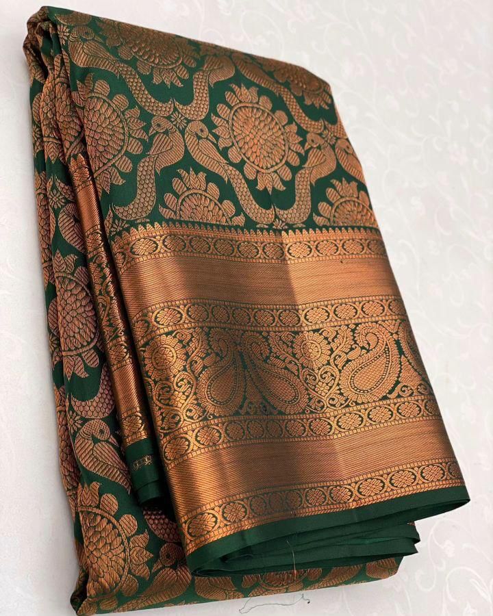 Intricate Dark Green Soft Silk Saree With Glorious Blouse Piece