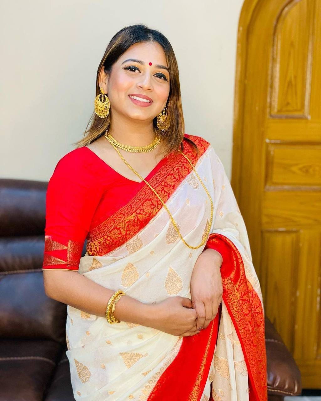 Sreemati - White Silk Saree with Golden Zari Motifs and Red Border