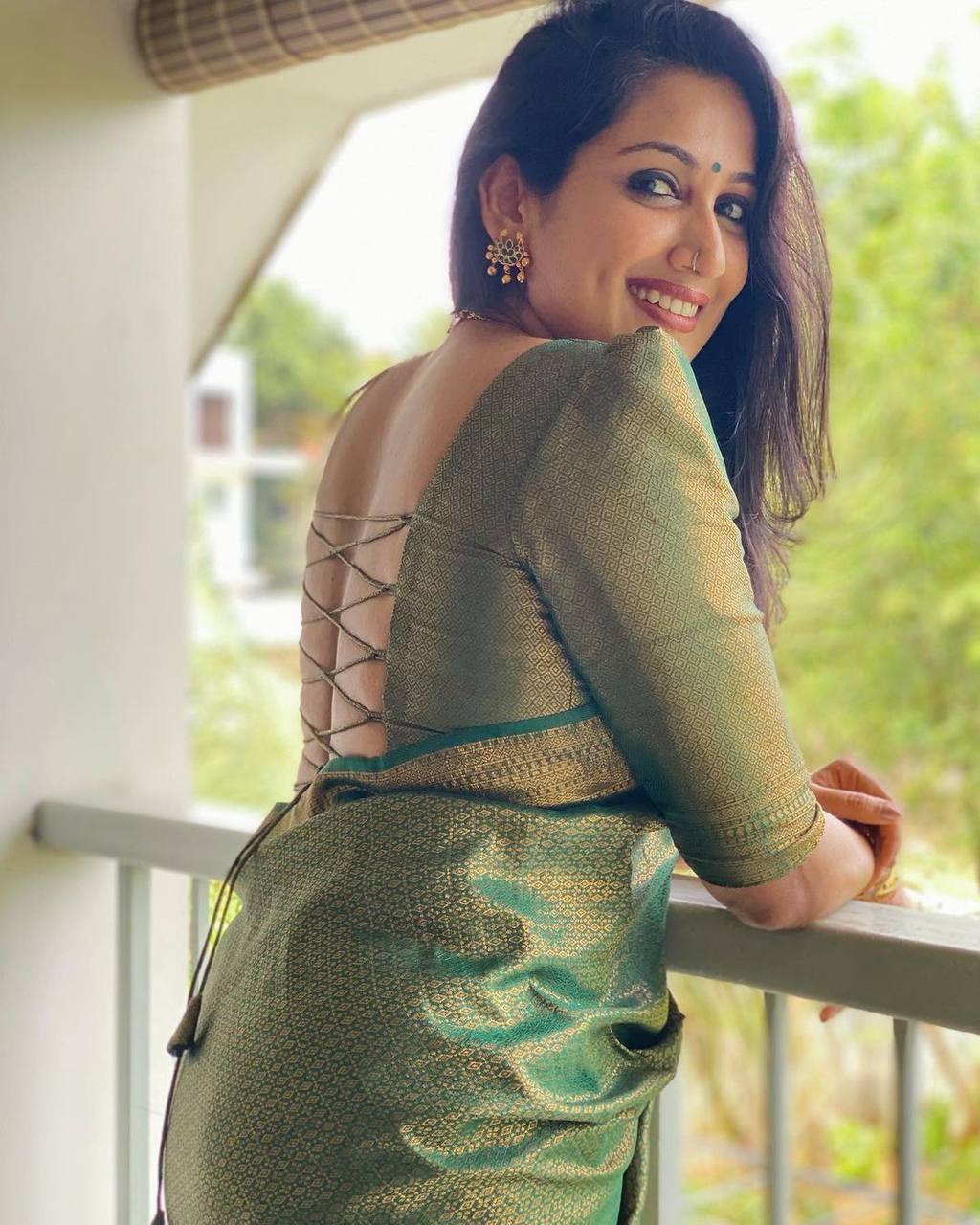 Mitera Green Woven Designer Party Wear Soft Silk  Lichi Silk Saree .