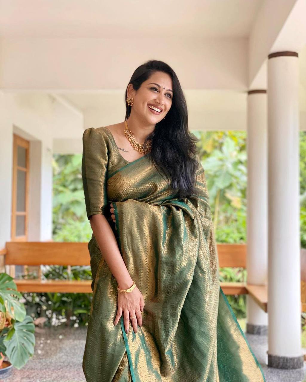 Mitera Green Woven Designer Party Wear Soft Silk  Lichi Silk Saree .