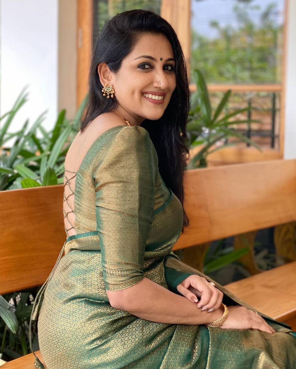 Mitera Green Woven Designer Party Wear Soft Silk  Lichi Silk Saree .