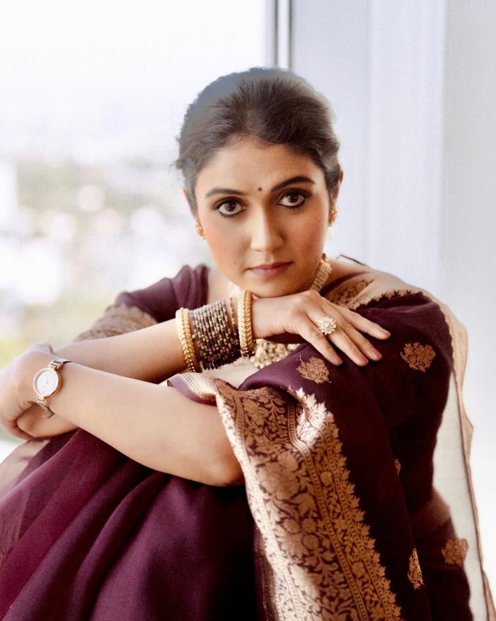 Praveena - Maroon Organza Silk Saree with Floral Zari Motifs and Brocade Border